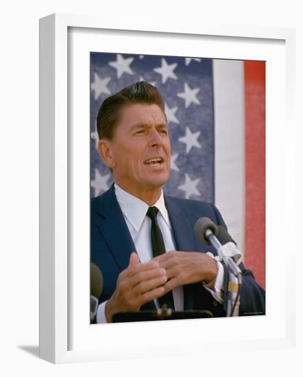 California Gubernatorial Candidate Ronald Reagan Speaking in Front of American Flag Backdrop-Bill Ray-Framed Photographic Print