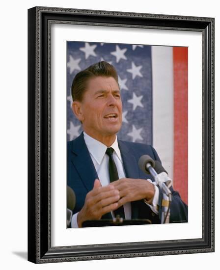 California Gubernatorial Candidate Ronald Reagan Speaking in Front of American Flag Backdrop-Bill Ray-Framed Photographic Print