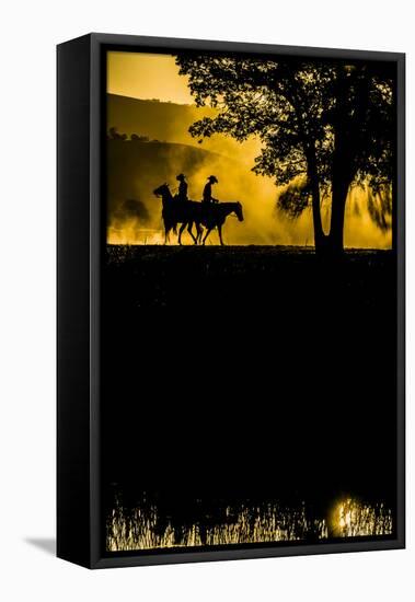 California, Parkfield, V6 Ranch silhouette of two riders faced opposite directions on horseback.-Ellen Clark-Framed Premier Image Canvas