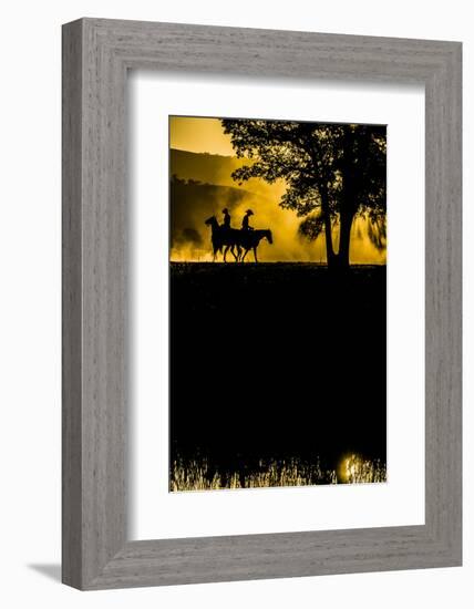 California, Parkfield, V6 Ranch silhouette of two riders faced opposite directions on horseback.-Ellen Clark-Framed Photographic Print