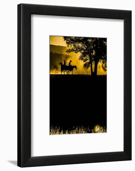 California, Parkfield, V6 Ranch silhouette of two riders faced opposite directions on horseback.-Ellen Clark-Framed Photographic Print