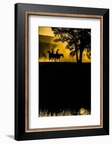 California, Parkfield, V6 Ranch silhouette of two riders faced opposite directions on horseback.-Ellen Clark-Framed Photographic Print