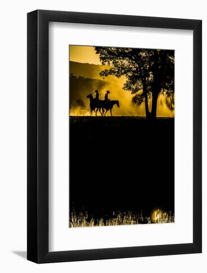 California, Parkfield, V6 Ranch silhouette of two riders faced opposite directions on horseback.-Ellen Clark-Framed Photographic Print