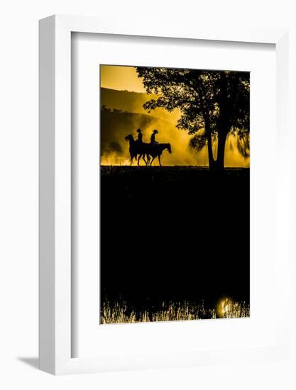 California, Parkfield, V6 Ranch silhouette of two riders faced opposite directions on horseback.-Ellen Clark-Framed Photographic Print