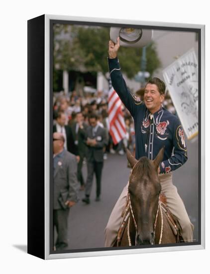 California Republican Gubernatorial Candidate Ronald Reagan in Cowboy Attire, Riding Horse Outside-Bill Ray-Framed Premier Image Canvas