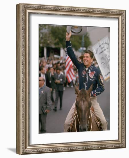 California Republican Gubernatorial Candidate Ronald Reagan in Cowboy Attire, Riding Horse Outside-Bill Ray-Framed Photographic Print