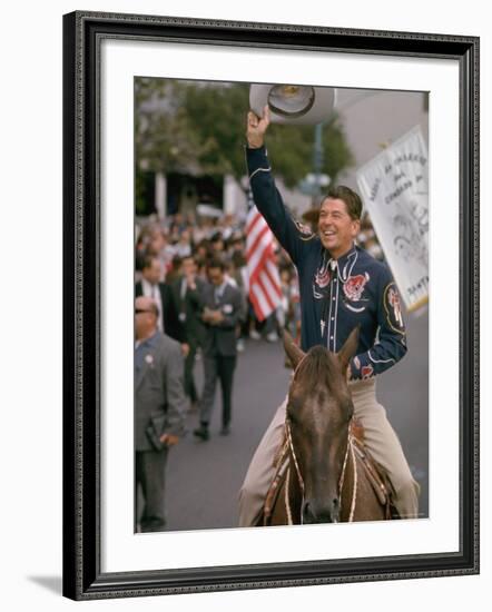 California Republican Gubernatorial Candidate Ronald Reagan in Cowboy Attire, Riding Horse Outside-Bill Ray-Framed Photographic Print
