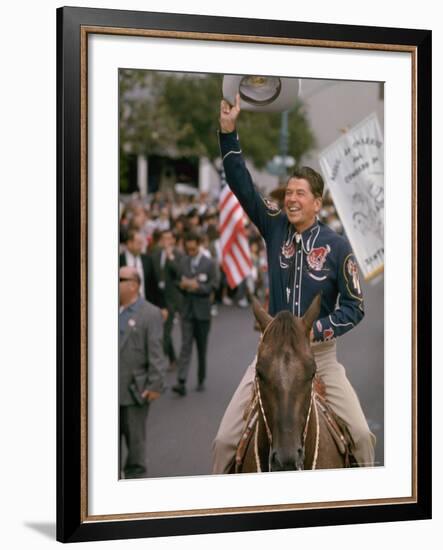 California Republican Gubernatorial Candidate Ronald Reagan in Cowboy Attire, Riding Horse Outside-Bill Ray-Framed Photographic Print