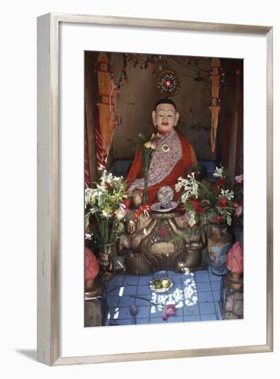 Cambodia, Phnom Penh, Statue in Vat Phnom Pagoda-null-Framed Giclee Print