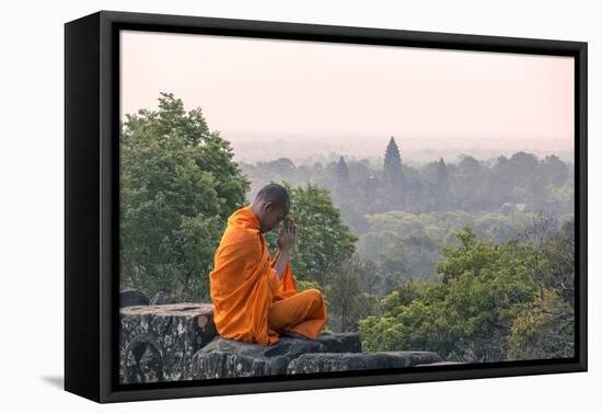 Cambodia, Siem Reap, Angkor Wat Complex. Monk Meditating with Angor Wat Temple in the Background-Matteo Colombo-Framed Premier Image Canvas