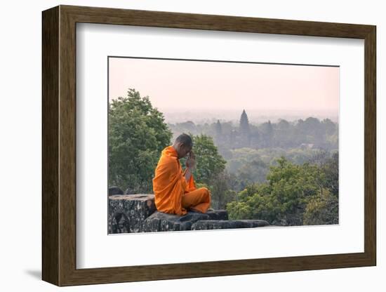 Cambodia, Siem Reap, Angkor Wat Complex. Monk Meditating with Angor Wat Temple in the Background-Matteo Colombo-Framed Photographic Print