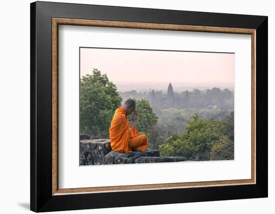 Cambodia, Siem Reap, Angkor Wat Complex. Monk Meditating with Angor Wat Temple in the Background-Matteo Colombo-Framed Photographic Print