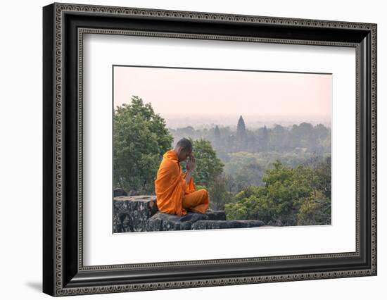 Cambodia, Siem Reap, Angkor Wat Complex. Monk Meditating with Angor Wat Temple in the Background-Matteo Colombo-Framed Photographic Print