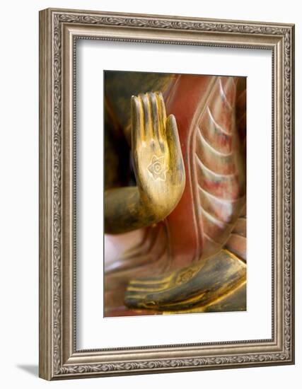 Cambodia, Siem Reap, golden hands on red wood statue of Buddha.-Merrill Images-Framed Photographic Print