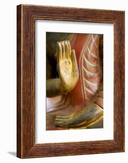 Cambodia, Siem Reap, golden hands on red wood statue of Buddha.-Merrill Images-Framed Photographic Print