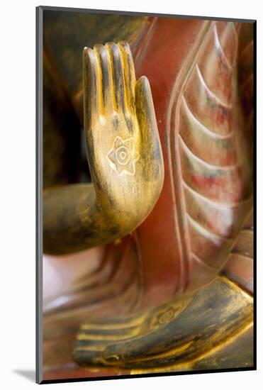 Cambodia, Siem Reap, golden hands on red wood statue of Buddha.-Merrill Images-Mounted Photographic Print