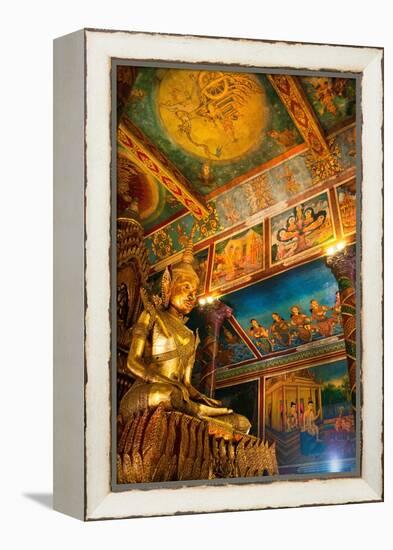 Cambodia. Wat Phnom is the cities highest point in Phnom Penh. Statues inside the temple.-Micah Wright-Framed Premier Image Canvas