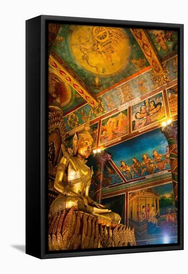 Cambodia. Wat Phnom is the cities highest point in Phnom Penh. Statues inside the temple.-Micah Wright-Framed Premier Image Canvas