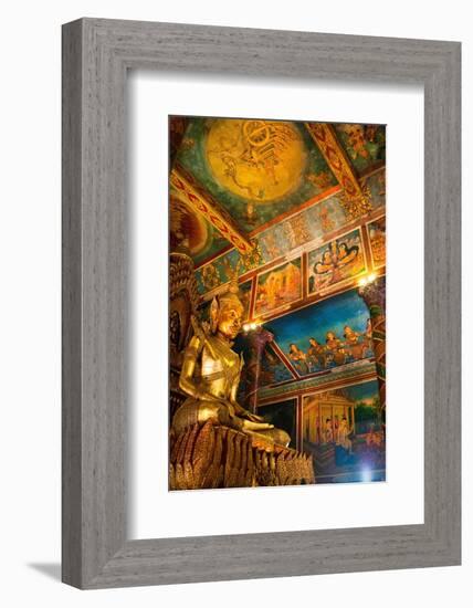 Cambodia. Wat Phnom is the cities highest point in Phnom Penh. Statues inside the temple.-Micah Wright-Framed Photographic Print