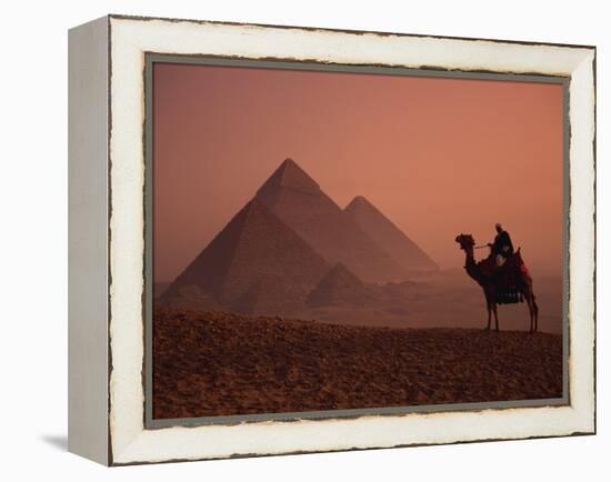 Camel and Rider at Giza Pyramids, UNESCO World Heritage Site, Giza, Cairo, Egypt-Howell Michael-Framed Premier Image Canvas