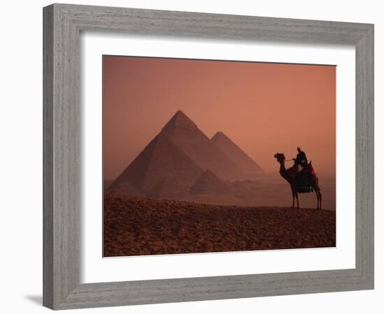 Camel and Rider at Giza Pyramids, UNESCO World Heritage Site, Giza, Cairo, Egypt-Howell Michael-Framed Photographic Print