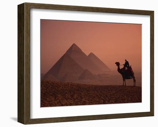 Camel and Rider at Giza Pyramids, UNESCO World Heritage Site, Giza, Cairo, Egypt-Howell Michael-Framed Photographic Print