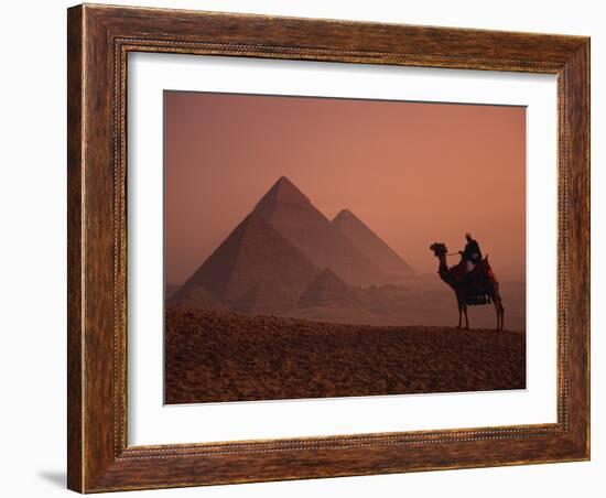 Camel and Rider at Giza Pyramids, UNESCO World Heritage Site, Giza, Cairo, Egypt-Howell Michael-Framed Photographic Print