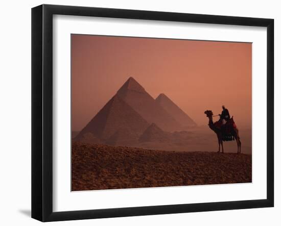 Camel and Rider at Giza Pyramids, UNESCO World Heritage Site, Giza, Cairo, Egypt-Howell Michael-Framed Photographic Print