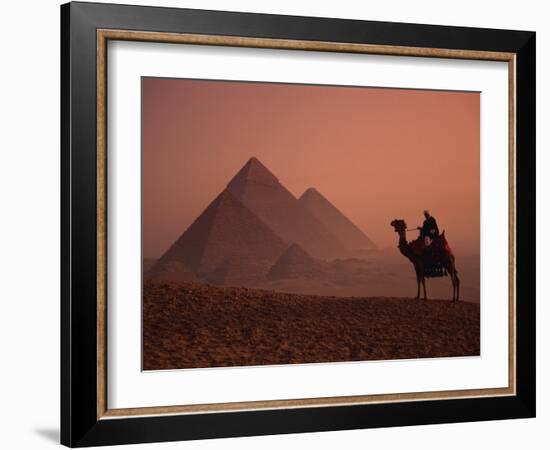 Camel and Rider at Giza Pyramids, UNESCO World Heritage Site, Giza, Cairo, Egypt-Howell Michael-Framed Photographic Print