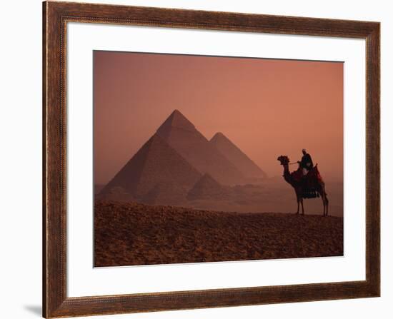 Camel and Rider at Giza Pyramids, UNESCO World Heritage Site, Giza, Cairo, Egypt-Howell Michael-Framed Photographic Print