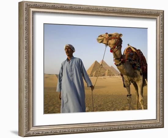 Camel Driver Stands in Front of the Pyramids at Giza, Egypt-Julian Love-Framed Photographic Print