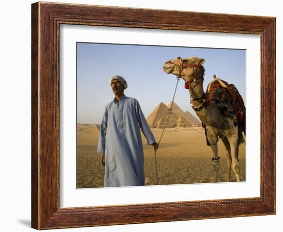 Camel Driver Stands in Front of the Pyramids at Giza, Egypt-Julian Love-Framed Photographic Print