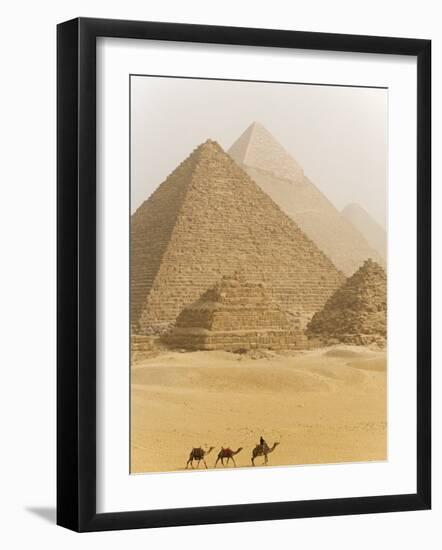 Camels Pass in Front of the Pyramids at Giza, Egypt-Julian Love-Framed Photographic Print