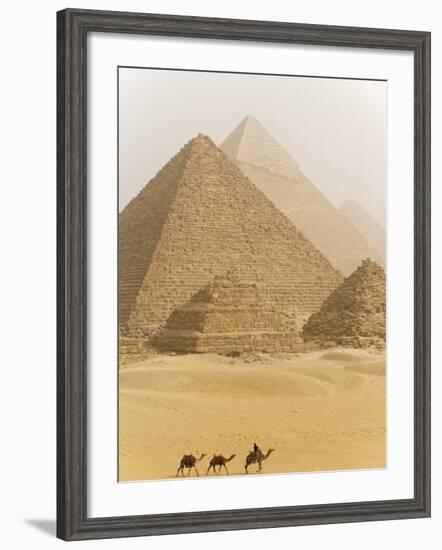 Camels Pass in Front of the Pyramids at Giza, Egypt-Julian Love-Framed Photographic Print