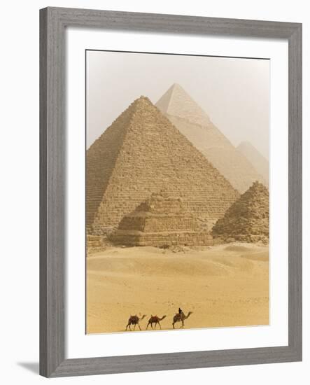 Camels Pass in Front of the Pyramids at Giza, Egypt-Julian Love-Framed Photographic Print