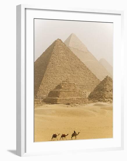 Camels Pass in Front of the Pyramids at Giza, Egypt-Julian Love-Framed Photographic Print