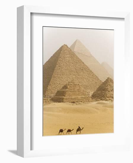 Camels Pass in Front of the Pyramids at Giza, Egypt-Julian Love-Framed Photographic Print