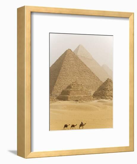 Camels Pass in Front of the Pyramids at Giza, Egypt-Julian Love-Framed Photographic Print