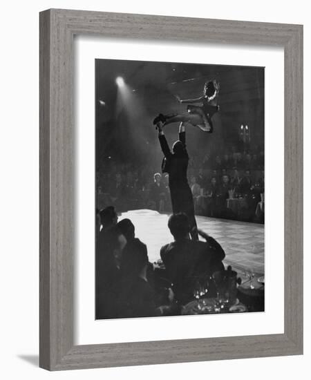 Can Can Dancer Held Up in the Air by a Performing Gentleman at the Paris Show-Nat Farbman-Framed Photographic Print