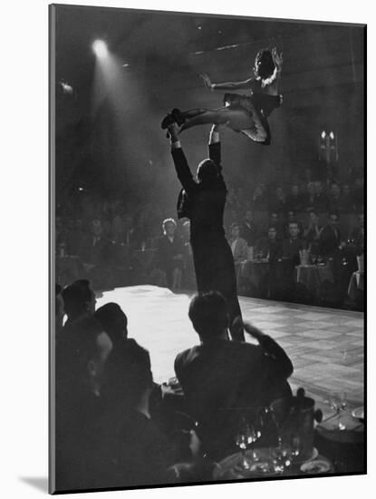 Can Can Dancer Held Up in the Air by a Performing Gentleman at the Paris Show-Nat Farbman-Mounted Photographic Print