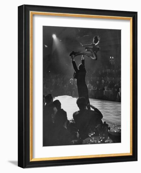 Can Can Dancer Held Up in the Air by a Performing Gentleman at the Paris Show-Nat Farbman-Framed Photographic Print