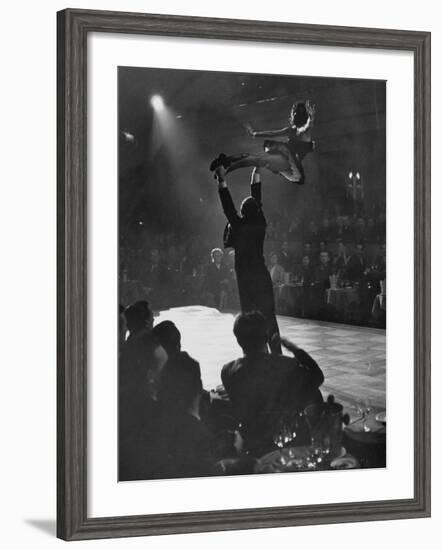 Can Can Dancer Held Up in the Air by a Performing Gentleman at the Paris Show-Nat Farbman-Framed Photographic Print