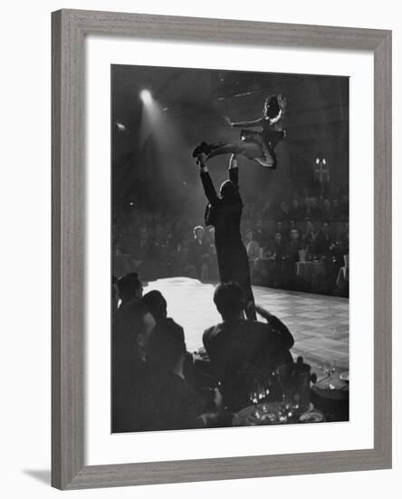 Can Can Dancer Held Up in the Air by a Performing Gentleman at the Paris Show-Nat Farbman-Framed Photographic Print