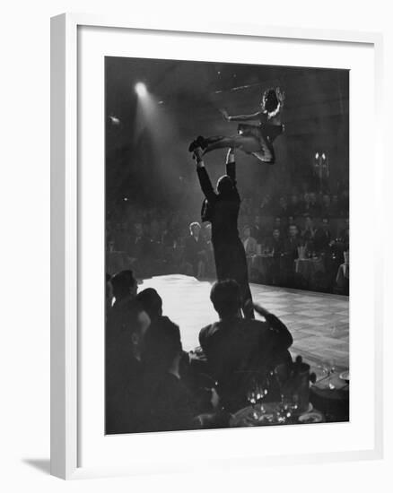 Can Can Dancer Held Up in the Air by a Performing Gentleman at the Paris Show-Nat Farbman-Framed Photographic Print