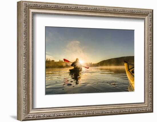 Canada, British Columbia. A kayaker paddles in morning mist on a Canadian lake.-Gary Luhm-Framed Photographic Print