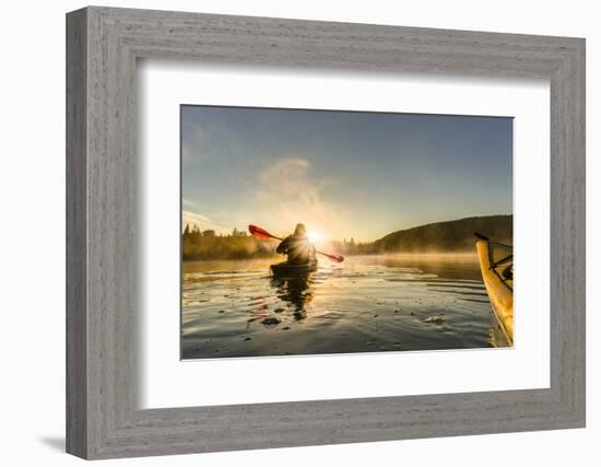 Canada, British Columbia. A kayaker paddles in morning mist on a Canadian lake.-Gary Luhm-Framed Photographic Print