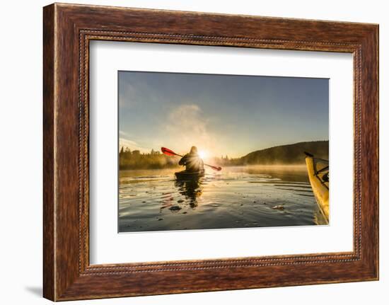 Canada, British Columbia. A kayaker paddles in morning mist on a Canadian lake.-Gary Luhm-Framed Photographic Print