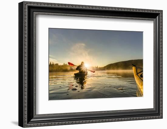 Canada, British Columbia. A kayaker paddles in morning mist on a Canadian lake.-Gary Luhm-Framed Photographic Print