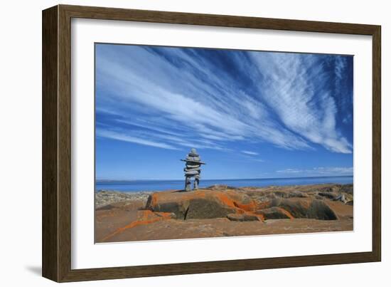 Canada, Manitoba, Churchill. Inukshuk on rocky shore of Hudson Bay.-Jaynes Gallery-Framed Photographic Print