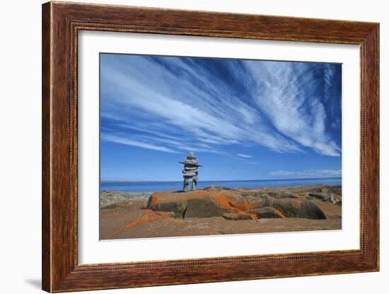 Canada, Manitoba, Churchill. Inukshuk on rocky shore of Hudson Bay.-Jaynes Gallery-Framed Photographic Print